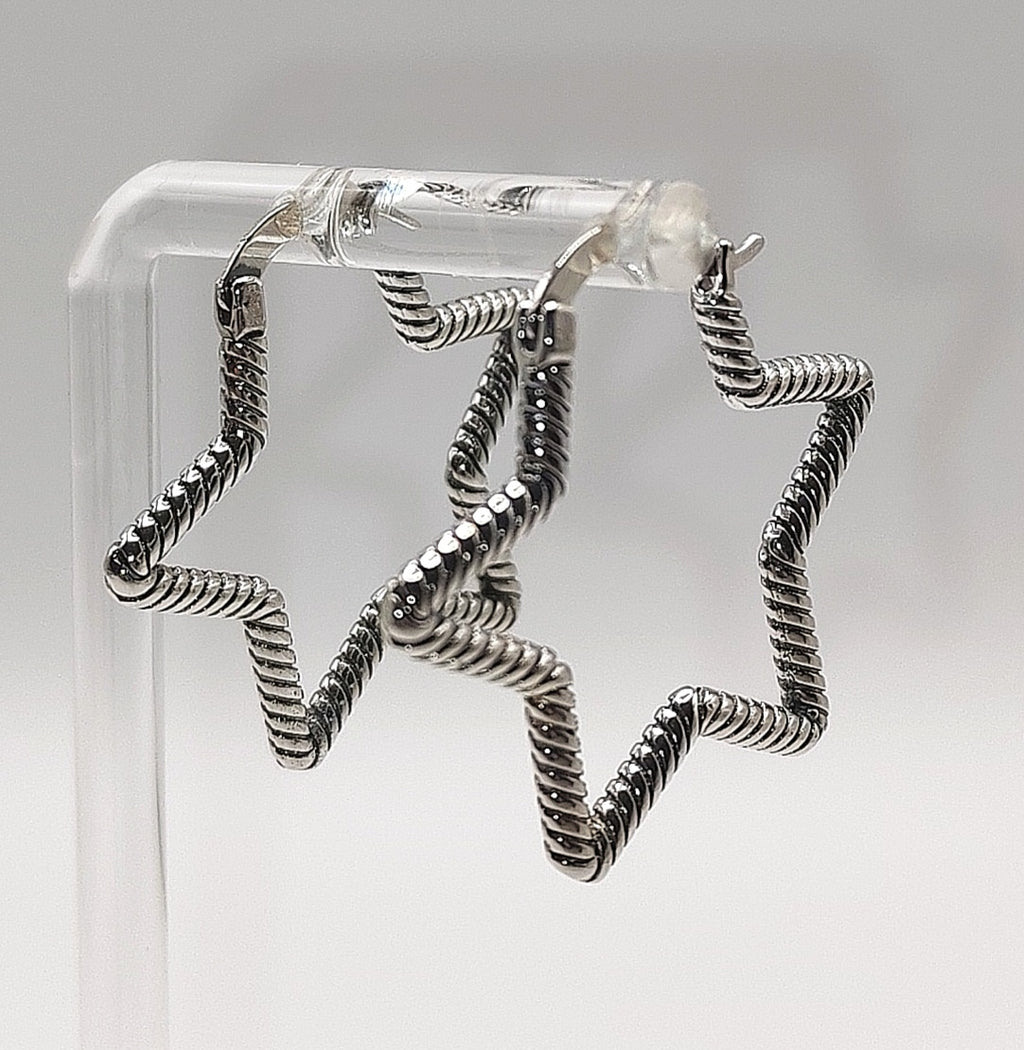 Sterling silver star hoop earrings with textured open star design