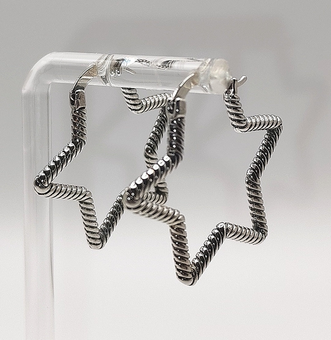 Sterling silver star hoop earrings with textured open star design
