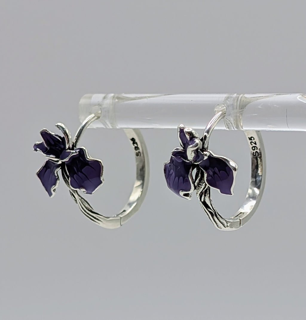 Pair of sterling silver floral hoop earrings with purple enamel flowers