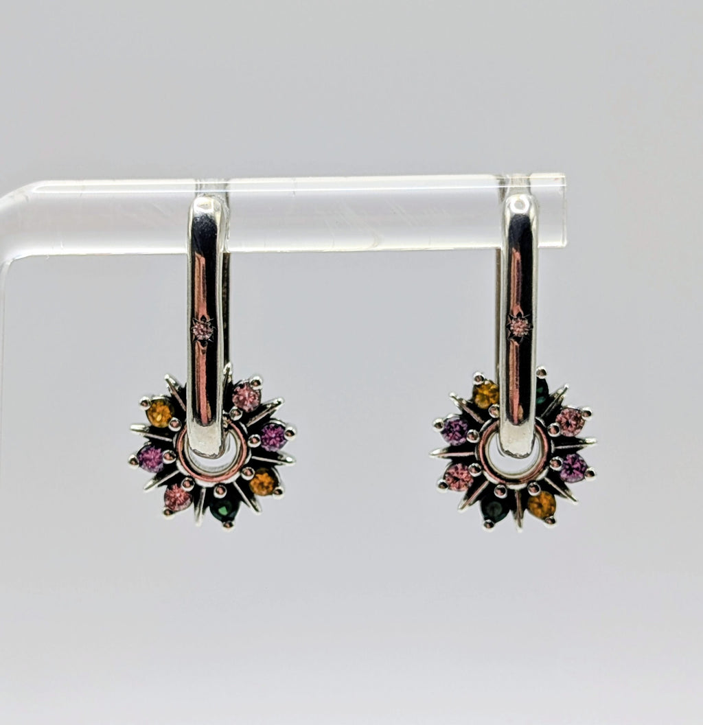 A pair of polished Sterling Silver oblong hoop earrings with a removable starburst charm set with multi-colour Cubic Zirconia stones (green, purple, yellow).