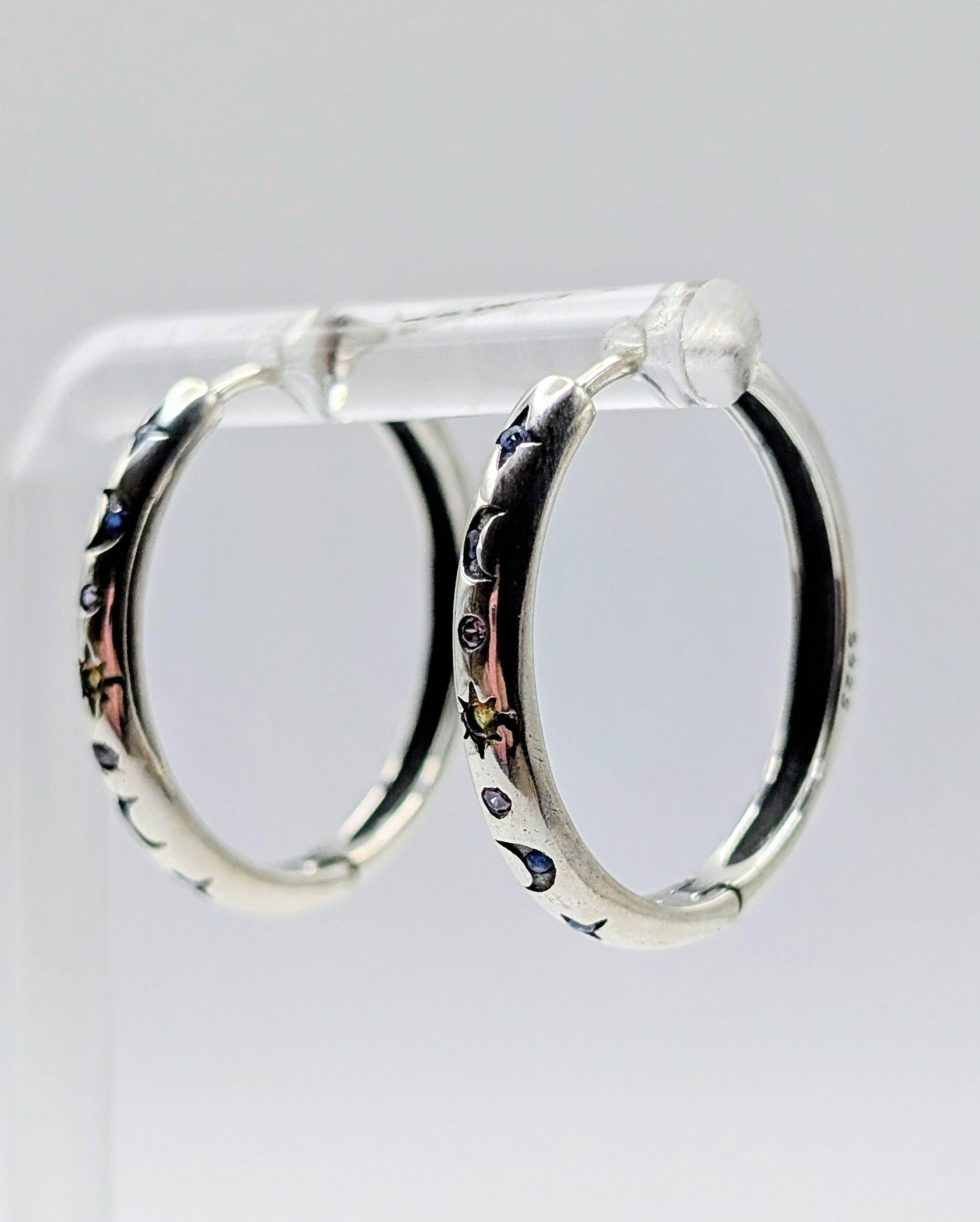Sterling Silver Mid-sized Moon and Star Hoop Earrings with Clear, Blue & Orange Zirconia's