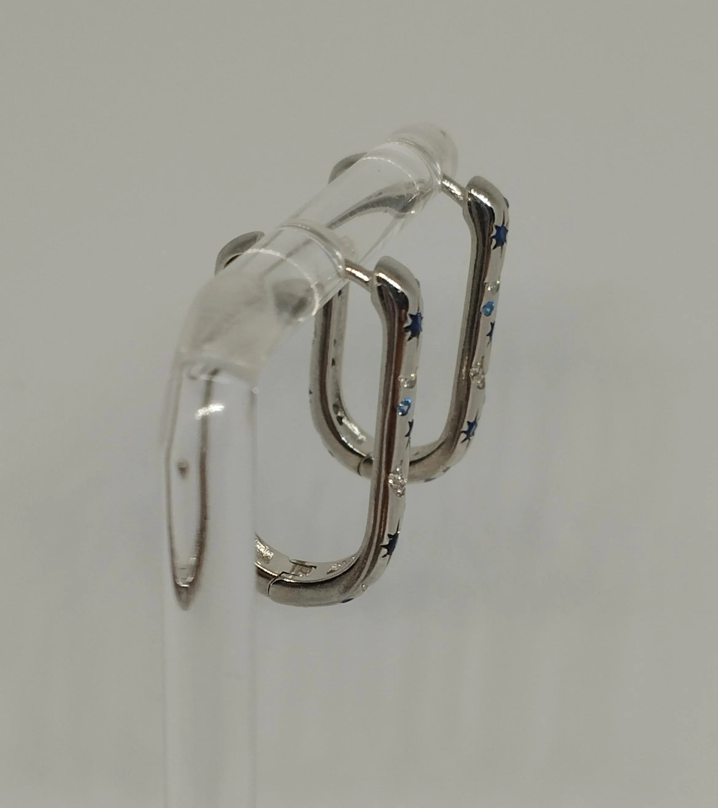 Sterling Silver Oblong Hoop Earrings with Moon Star Pattern And Blue Clear Zirconia Stones