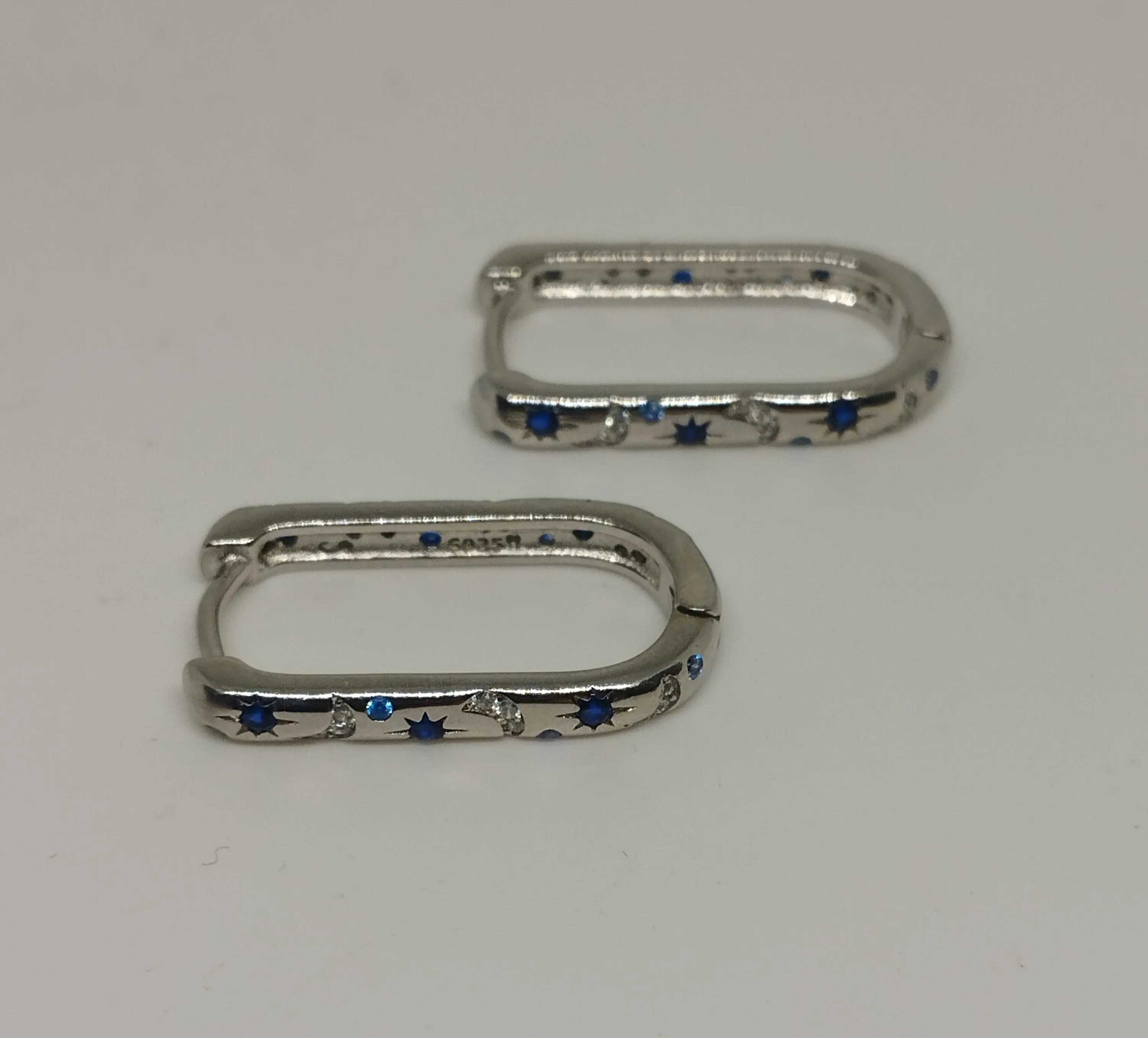 Sterling Silver Oblong Hoop Earrings with Moon Star Pattern And Blue Clear Zirconia Stones